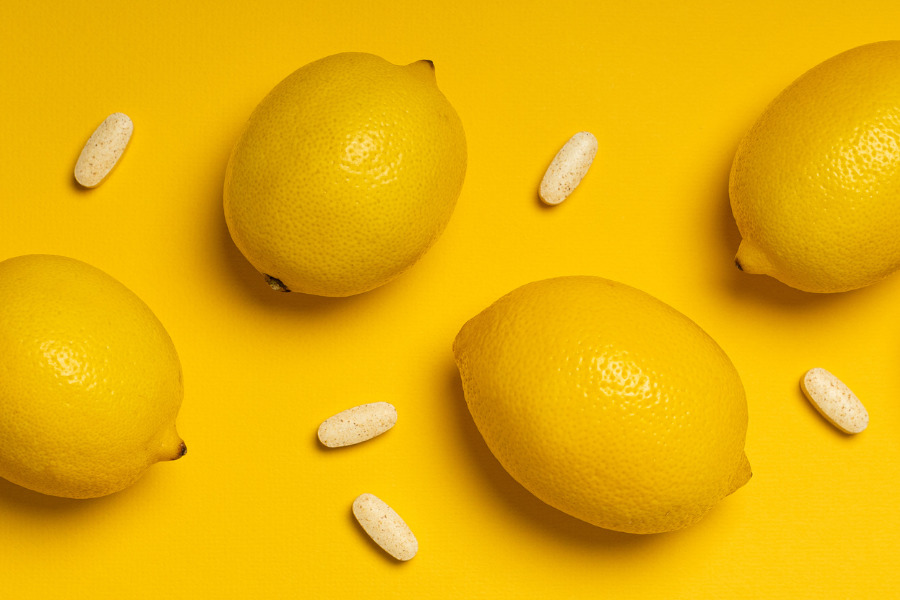 Vitamin C tablets and lemons